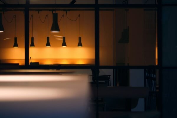 Modern office interior with pendant lights at night
