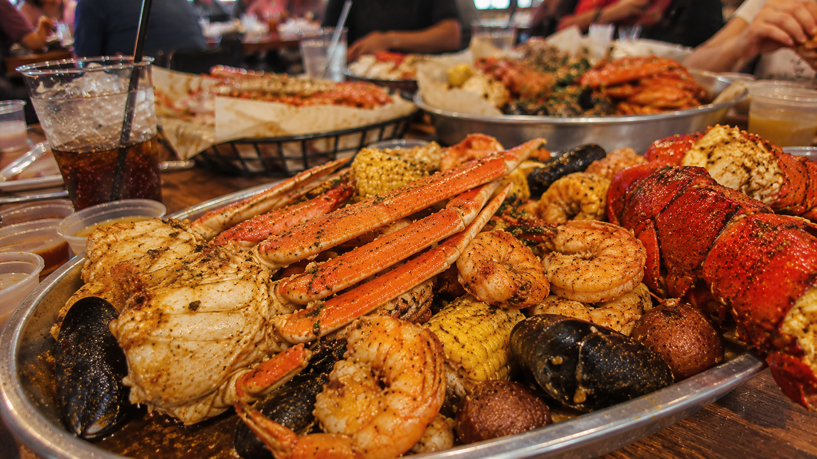Crab N Spice Carson Seafood feast at a bustling table