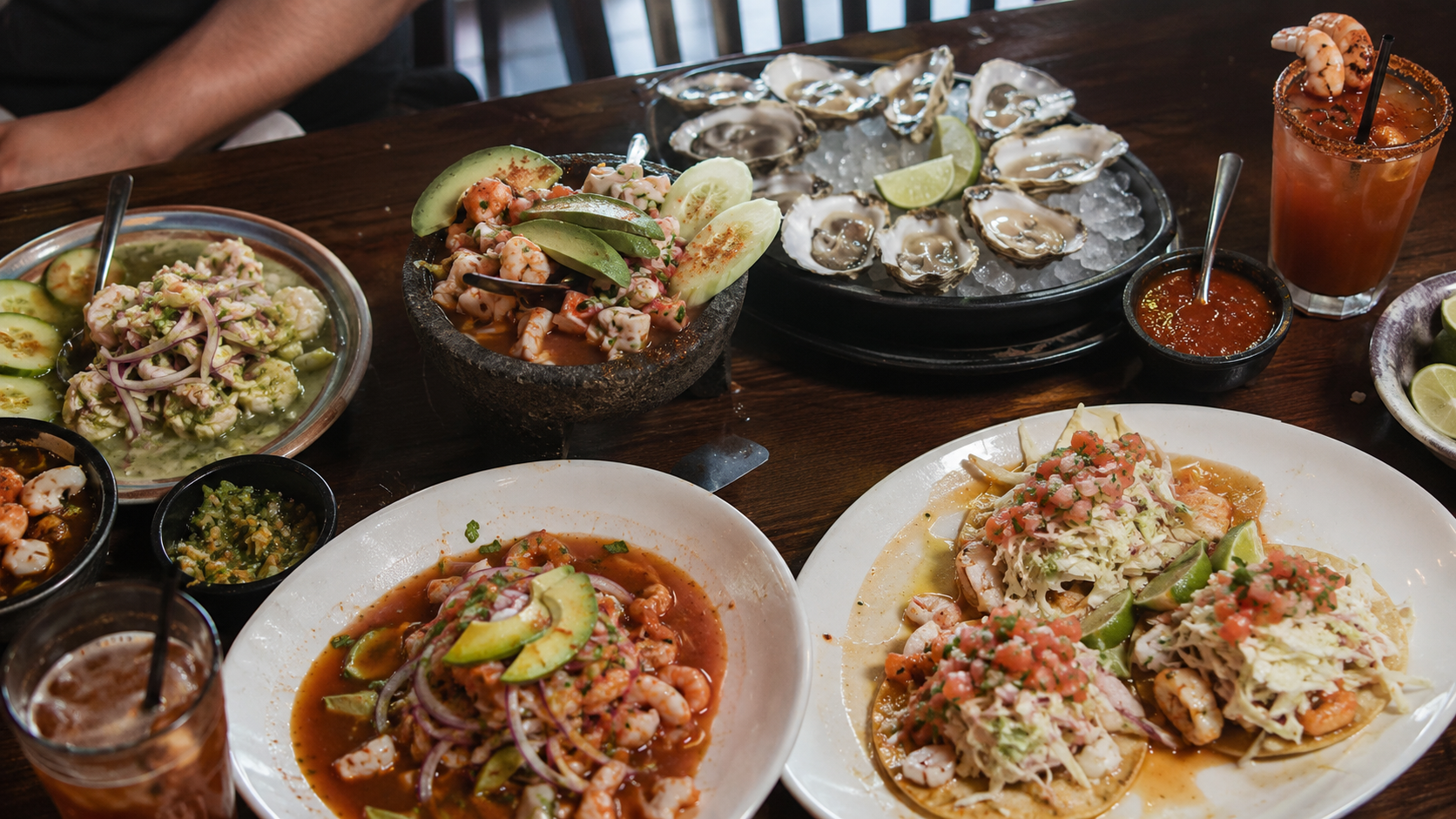 La Cruda Mariscos - Seafood feast with cocktails and condiments
