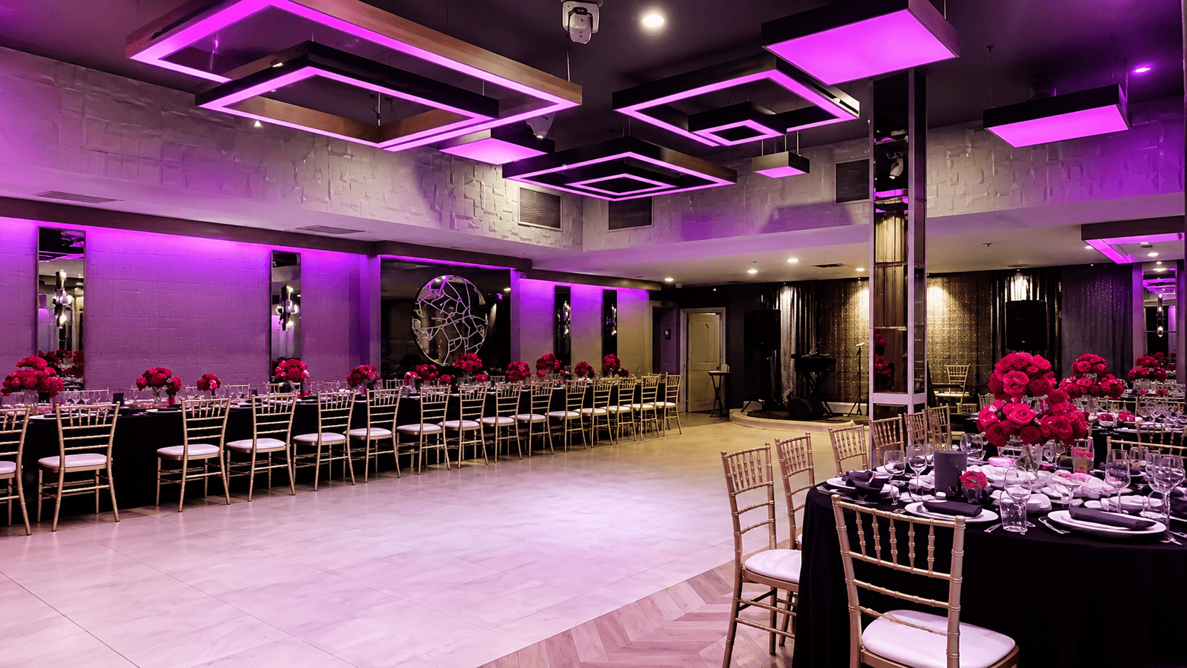 Reflections Venue Elegant event hall with magenta lighting