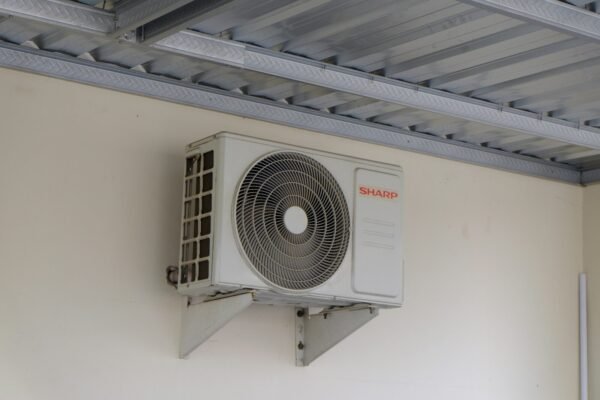An air conditioning unit mounted on a wall.