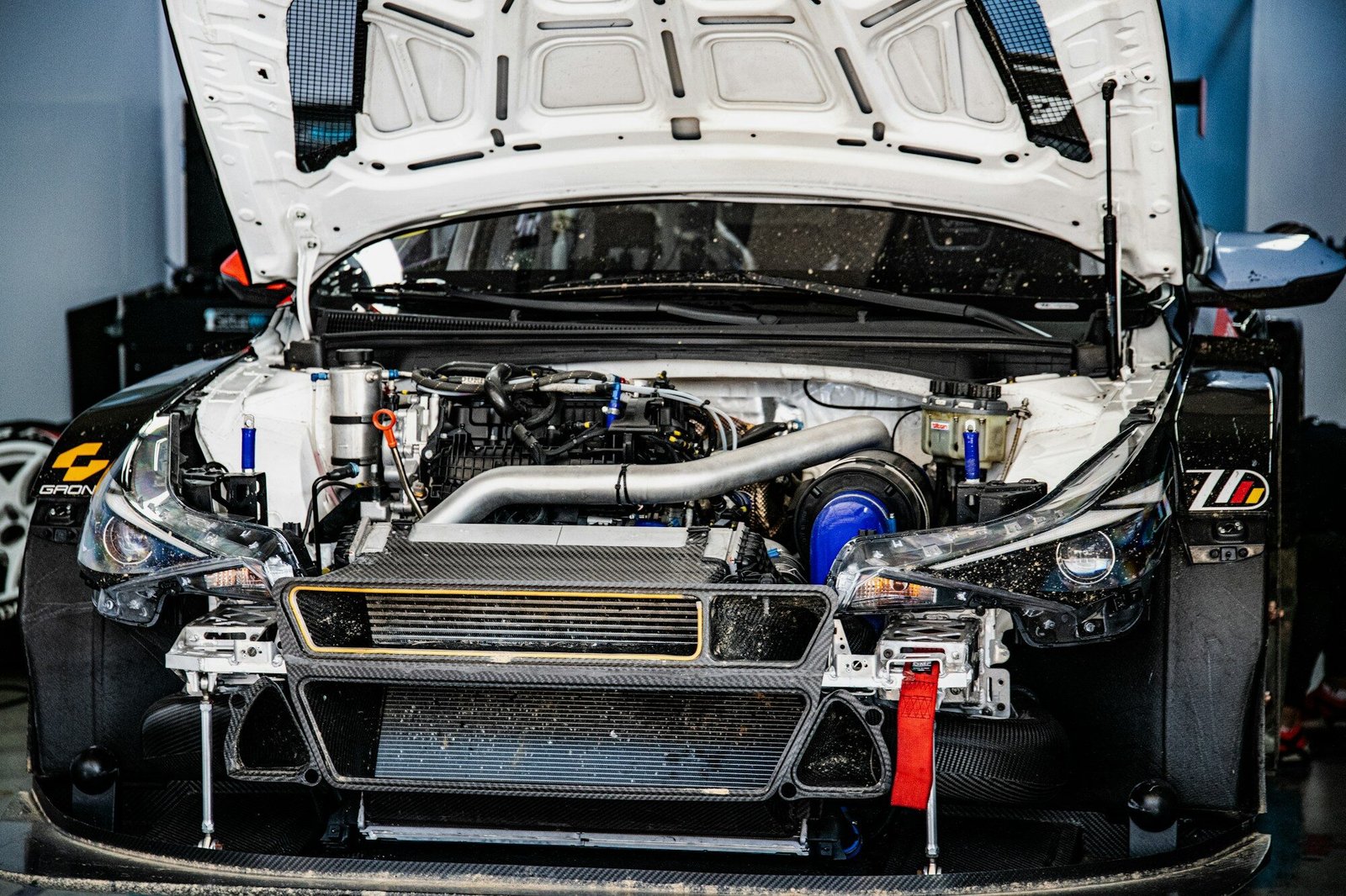 White race car engine compartment with hood open