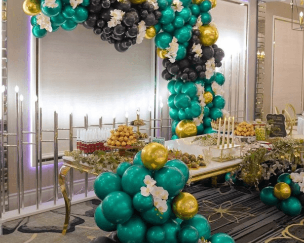 Custom-event-dessert-display-with-balloon-arch-at-Etage-Venue.png