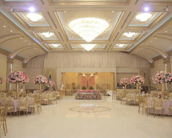 Elegant-ballroom-with-floral-decor-and-chandelier-lighting-for-wedding-celebrations.png