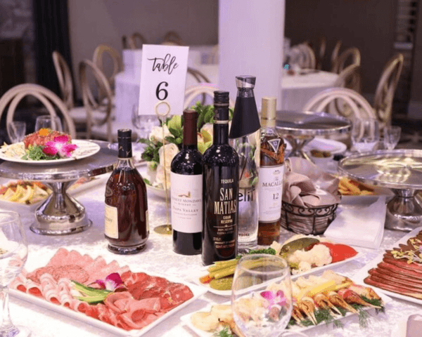 Elegant-banquet-table-featuring-wine-appetizers-charcuterie-and-event-catering.png