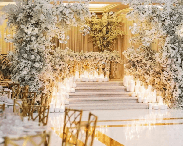 Luxury-wedding-reception-setup-with-white-floral-centerpieces-and-elegant-decor.png