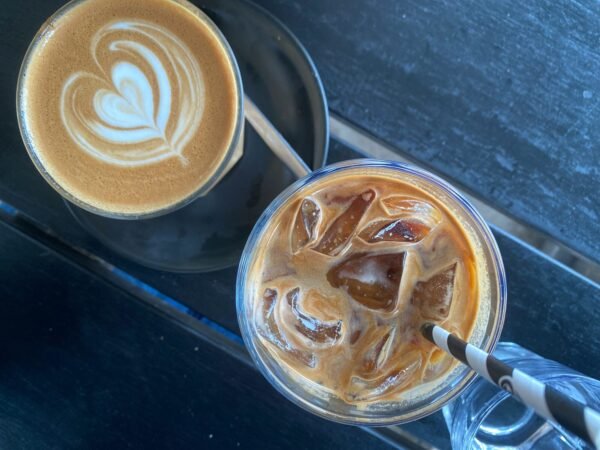 Two glasses of iced coffee on a table