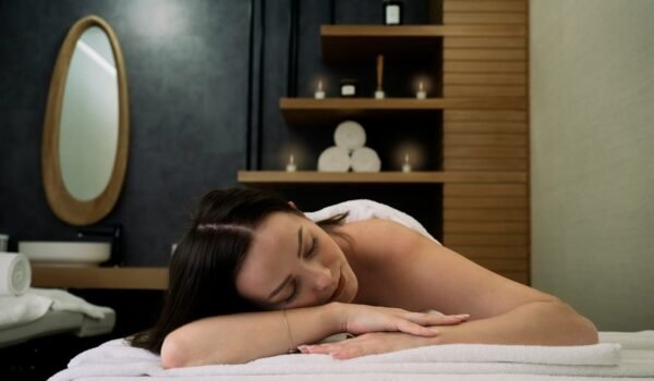 topless woman lying on bed